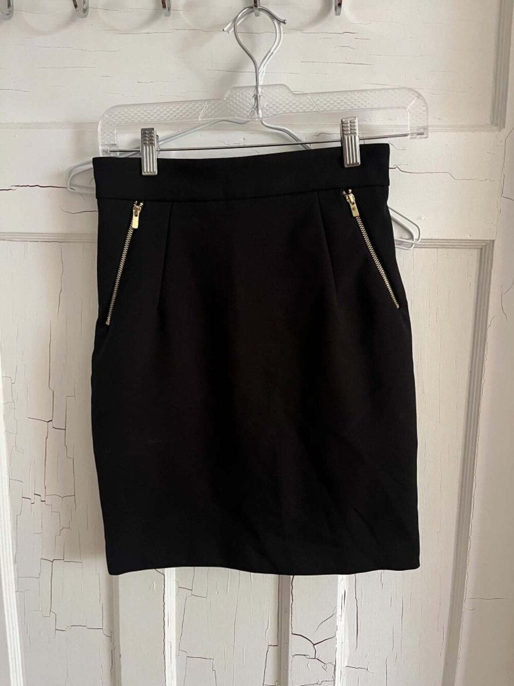 Black pencil skirt with gold zipper details